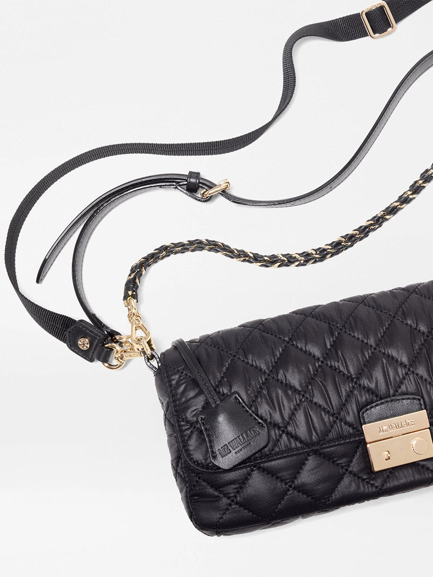 MZ Wallace Crosby Lock Baguette in Black Oxford, a quilted recycled nylon bag with a gold clasp, featuring a detachable webbed shoulder strap and a gold chain strap.