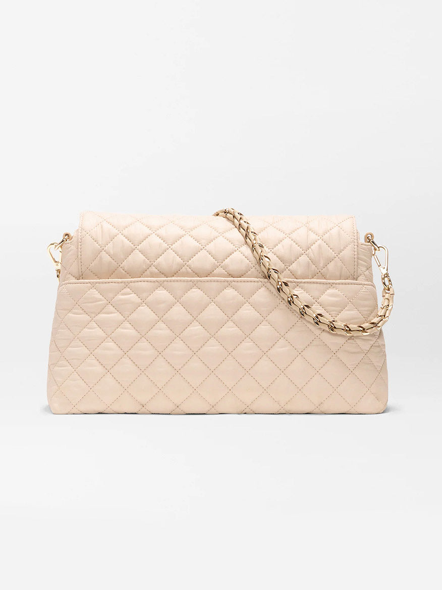 The MZ Wallace Crosby Lock Shoulder in Buff Oxford, crafted from Italian leather with a gold chain strap, is displayed against a plain white background.