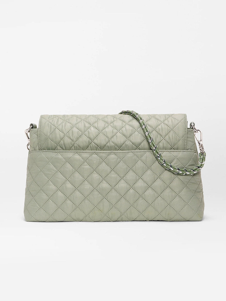 The MZ Wallace Crosby Lock Shoulder in Agave Green Oxford features a quilted design, flap closure, braided shoulder strap, and Italian leather trim, shown against a plain white background.
