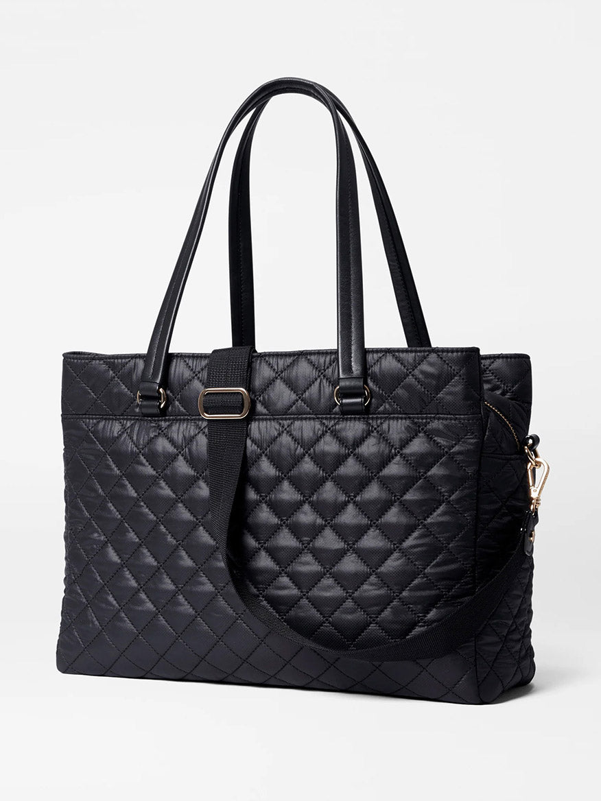The MZ Wallace Crosby Lock Tote in Black Oxford is a designer work bag featuring a sophisticated quilted design with two handles and a shoulder strap, perfect for any professional setting.