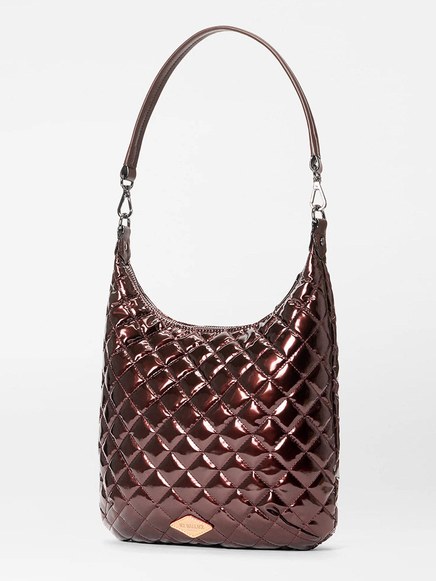The MZ Wallace Crosby Sienna in Bordeaux Lacquer Oxford is a metallic maroon quilted shoulder bag with a single strap and silver hardware, crafted from Italian leather and shown upright against a plain white background.