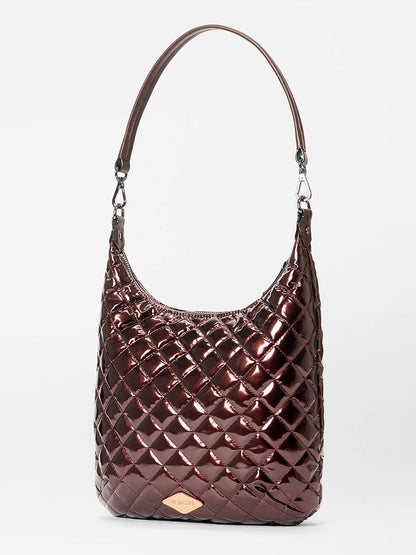 The MZ Wallace Crosby Sienna in Bordeaux Lacquer Oxford is a metallic maroon quilted shoulder bag with a single strap and silver hardware, crafted from Italian leather and shown upright against a plain white background.