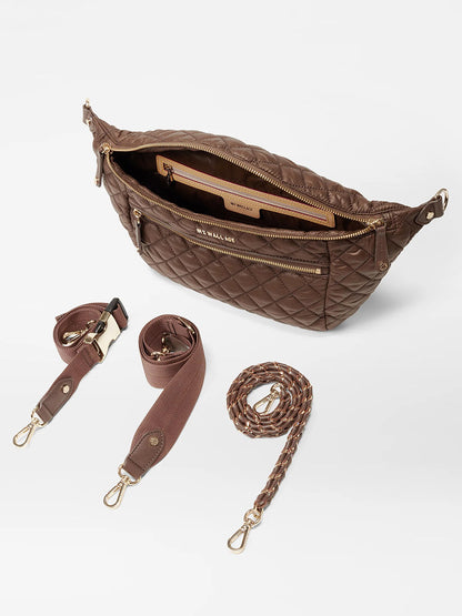 The MZ Wallace Crosby Crossbody Sling Bag in Walnut Oxford features multiple pockets and comes with both detachable solid and woven straps, making it perfect for hands-free convenience.