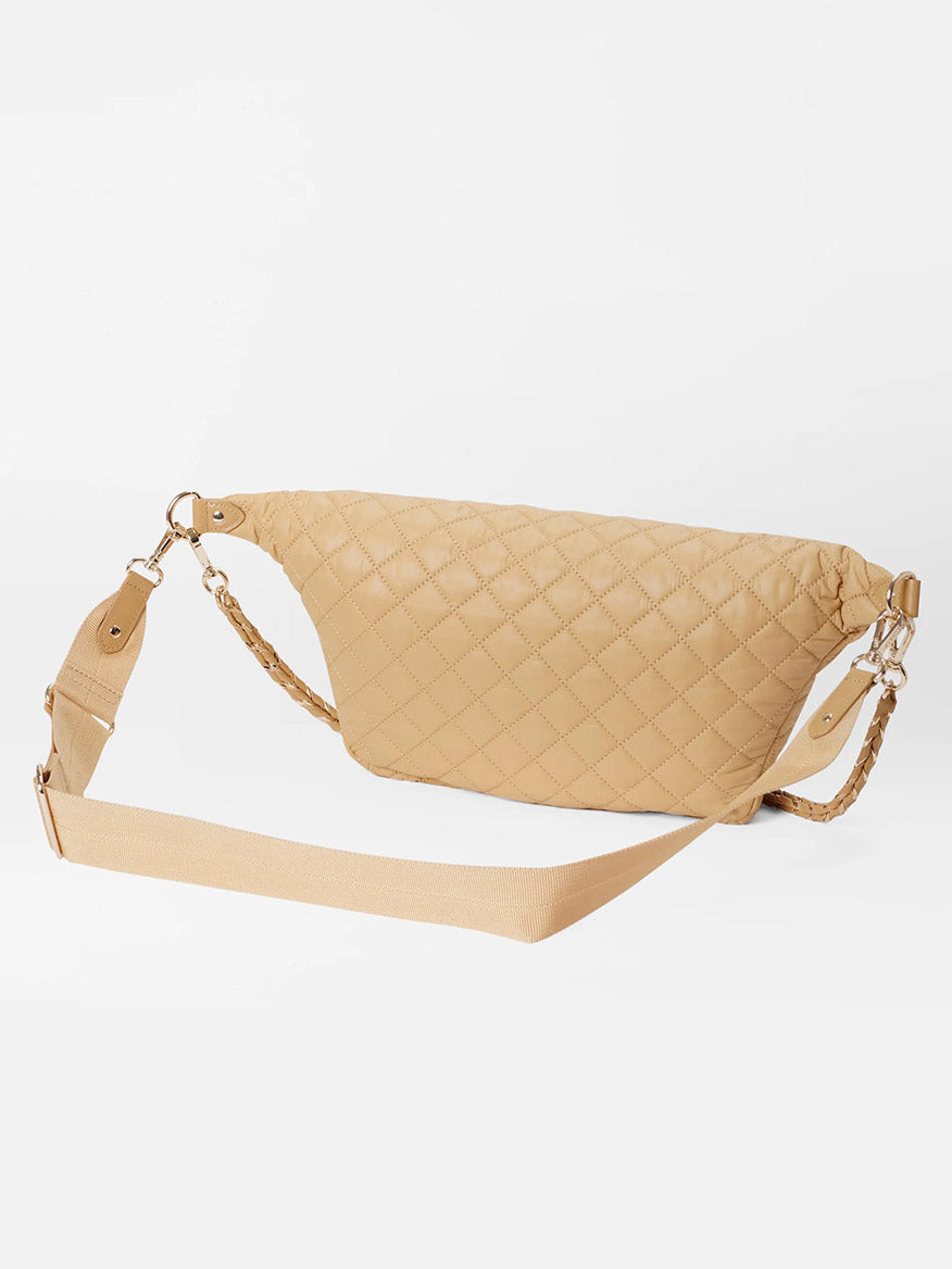 Beige quilted MZ Wallace Crosby Crossbody Sling Bag in Camel Oxford with a chain strap detail, offering a hands-free option.