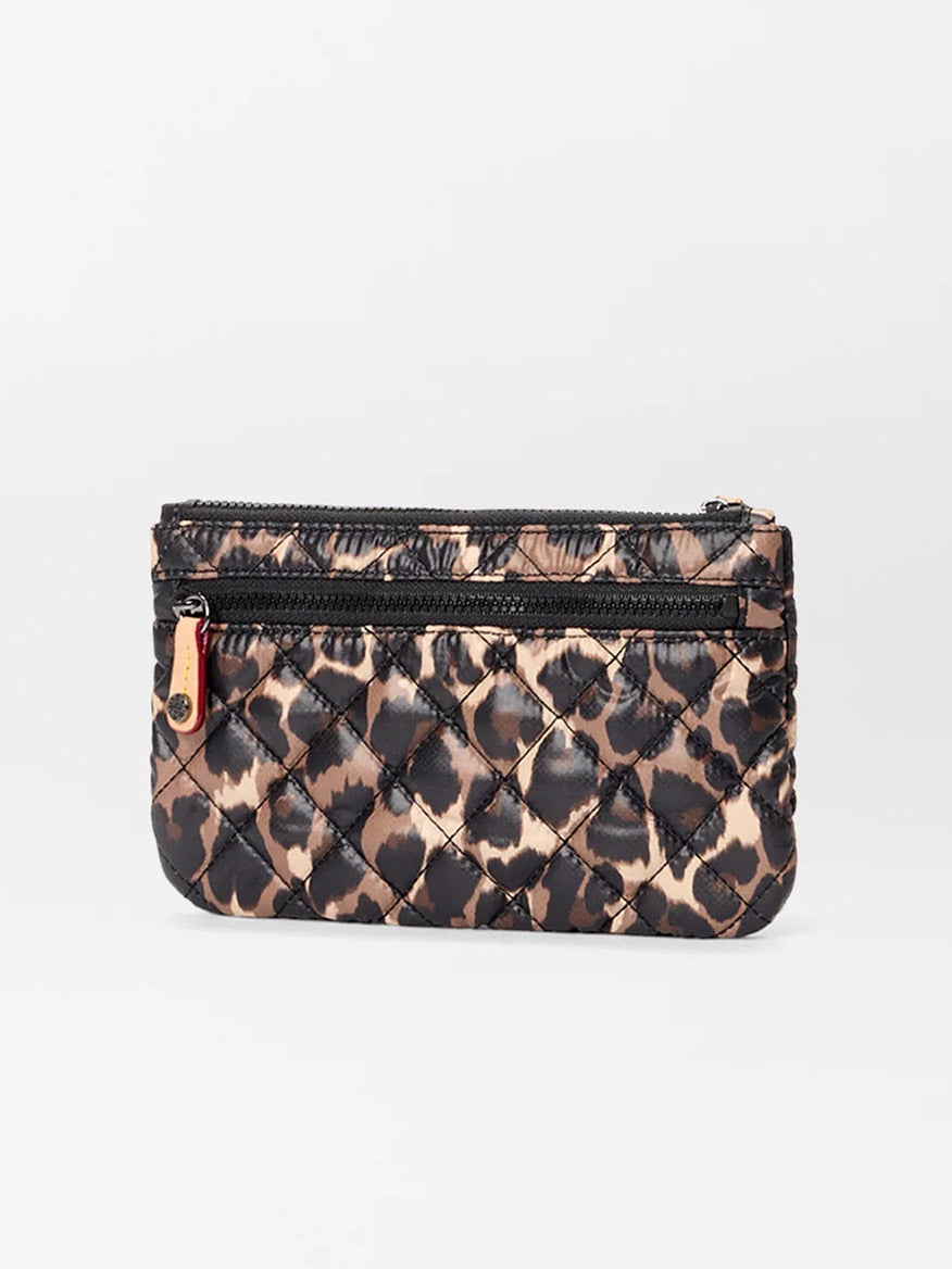 The MZ Wallace Flat Metro Wristlet in Leopard Oxford is a small quilted pouch made from REC Oxford Fabric, featuring a front zippered pocket and a zipper pull tab.