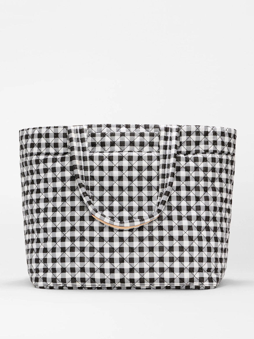 The MZ Wallace Large Metro Tote Deluxe in Black/White Gingham Oxford, travel-ready with two handles and ideal for carrying essentials, is displayed against a plain white background.