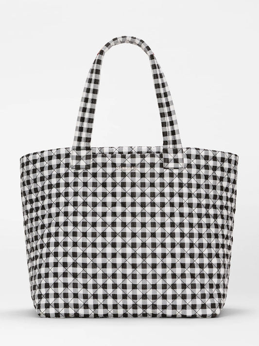The MZ Wallace Large Metro Tote Deluxe in Black/White Gingham Oxford features a travel-ready design with two handles, shown against a plain white background.