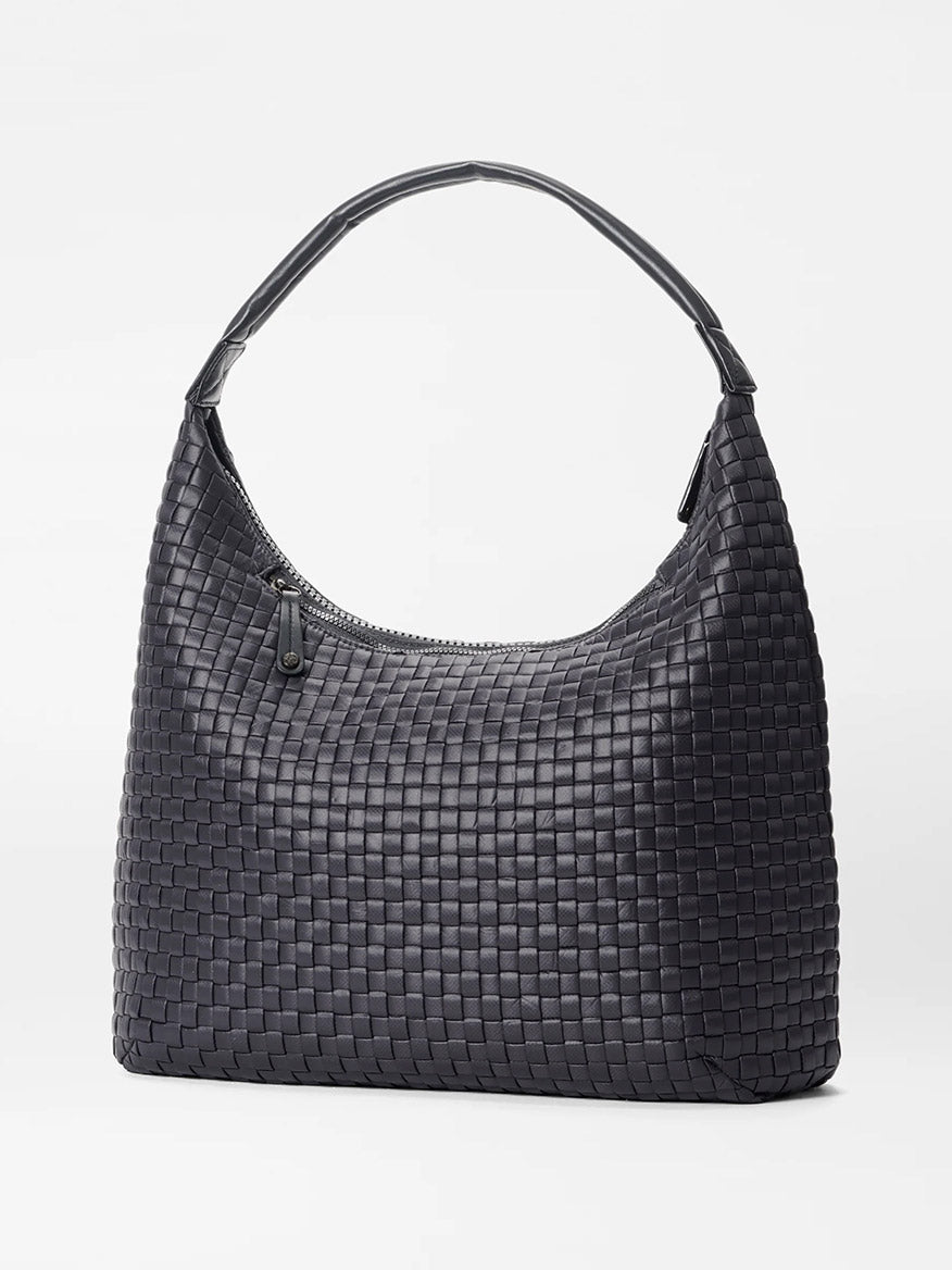 The MZ Wallace Large Woven Shoulder Bag in Black Oxford, featuring a curved handle and top zipper closure, perfect for daily organization, displayed against a plain white background.