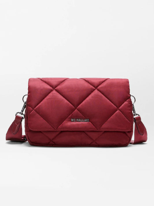 The MZ Wallace Madison Flap Crossbody in Claret Bedford, featuring quilted recycled Bedford nylon, silver hardware, and an adjustable strap, is shown against a plain white background.