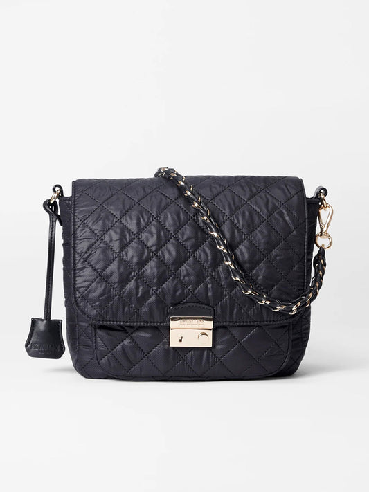 The MZ Wallace Crosby Lock Medium Crossbody in Black Oxford features a nylon quilted design, gold chain strap, and front clasp closure, offering the versatility of a crossbody style—perfect for those seeking a designer bag feel.