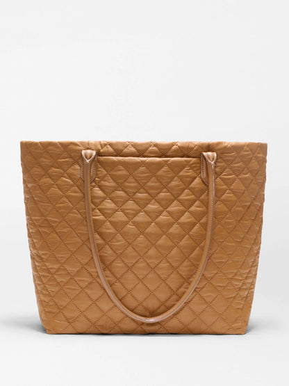 The MZ Wallace Medium Daily Tote in Cognac Oxford features tan lightweight quilted nylon with diamond stitching, two slim shoulder straps, and a rectangular silhouette—an ideal everyday carryall shown against a plain white background.