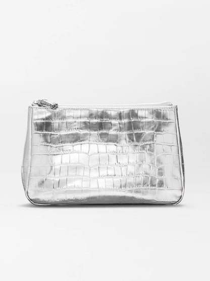 The MZ Wallace Medium Luna Cosmetic in Silver Croc Effect, featuring a zip top closure, is displayed against a plain, light background.