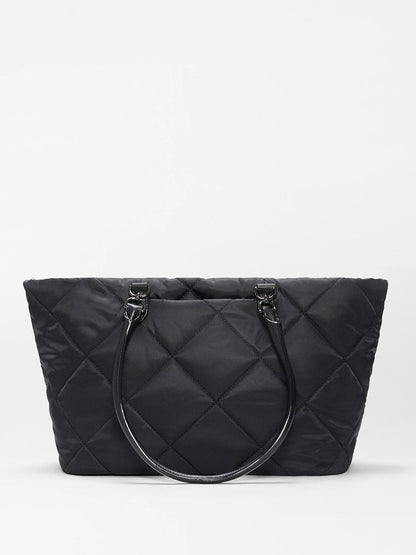 The MZ Wallace Medium Madison E-W Tote in Black Bedford features double handles and an adjustable nylon crossbody strap, shown against a white background.