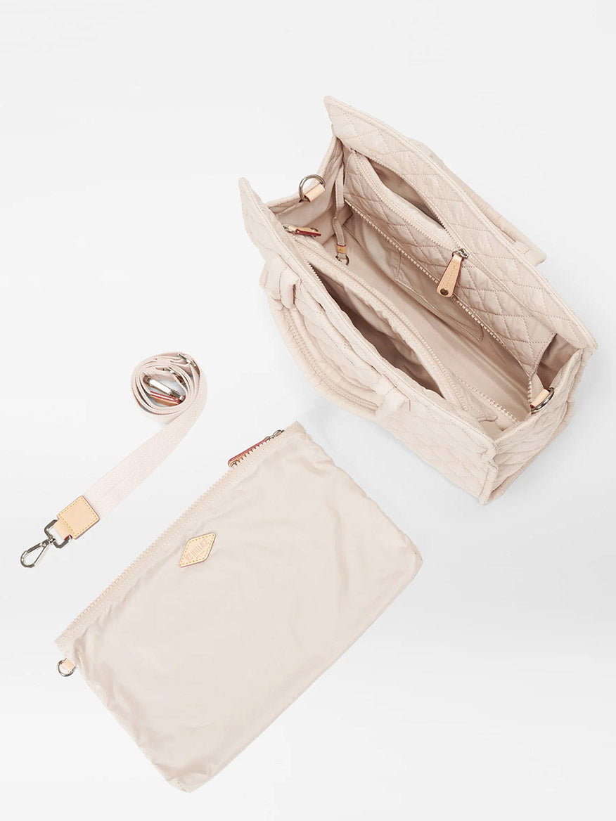 Open MZ Wallace Medium Box Tote in Mushroom Oxford with a detachable crossbody strap and a small pouch next to it, against a white background.