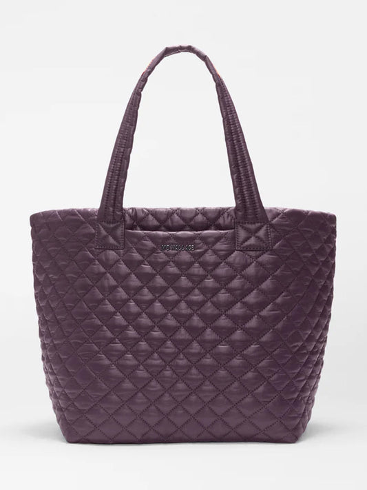 The MZ Wallace Medium Metro Tote Deluxe in Raisin Oxford features a diamond-quilted design, two handles, and a featherlight feel, shown here against a plain white background.