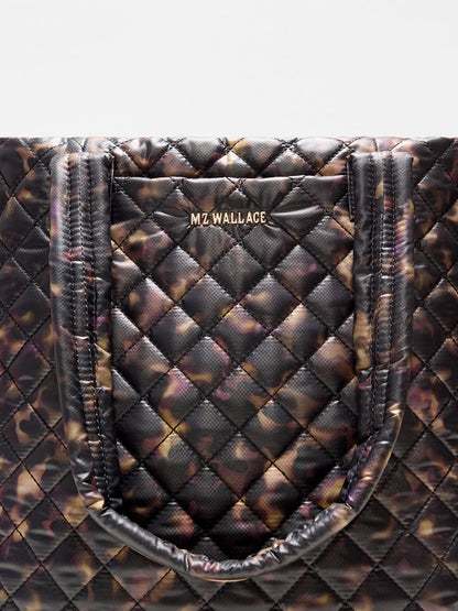 MZ Wallace Medium Metro Tote Deluxe in Tortoise Shell Oxford with black shoulder straps and an exterior slip pocket.