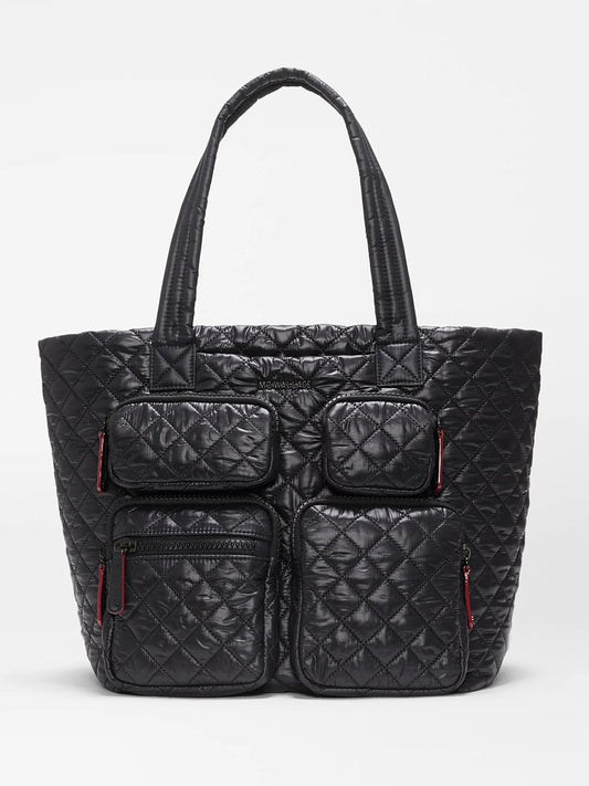 MZ Wallace Medium Metro Travel Tote in Black Oxford—this black quilted tote features two top handles and four front zippered pockets with distinctive red zipper pulls, all crafted from durable black nylon and shown against a plain white background, making it the perfect travel organizer bag.