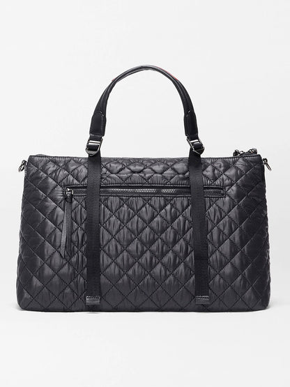 The MZ Wallace Medium Park Satchel in Black Oxford features two top handles, a front zippered pocket, and vertical strap detailing—an ideal everyday bag shown against a plain light background.