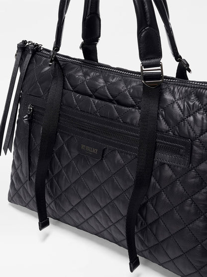 The MZ Wallace Medium Park Satchel in Black Oxford features dual handles, a front zip pocket, and a visible "MZ WALLACE" label—making it the perfect everyday quilted shoulder bag.