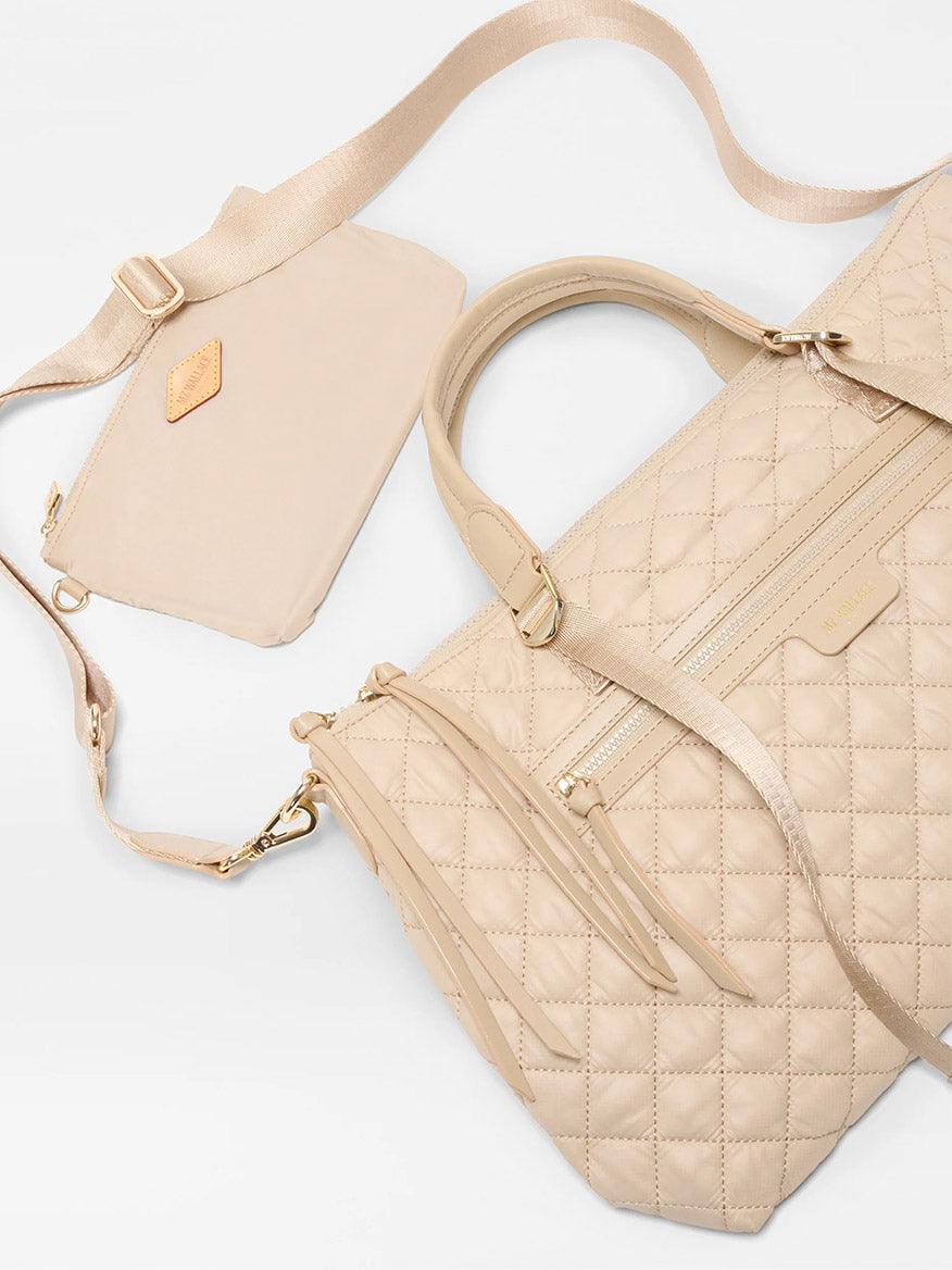 The MZ Wallace Medium Park Satchel in Buff Oxford, displayed on a white background, is a perfect choice for an everyday bag.