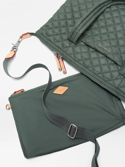 Two green quilted and smooth fabric bags made from recycled Oxford nylon—one being the MZ Wallace Medium Sutton Deluxe in Juniper Oxford—featuring zippers and adjustable straps for structured carry, are laid out on a white background.