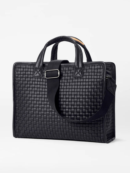 A MZ Wallace Medium Woven Box Tote in Black Oxford with top handles and a detachable shoulder strap, displayed against a light gray background.