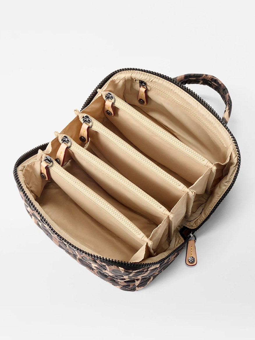 The MZ Wallace Metro Accordion Cosmetic II in Leopard Oxford features a leopard print, top zipper, Italian leather trim, four beige zippered interior pockets, and a small carrying handle.