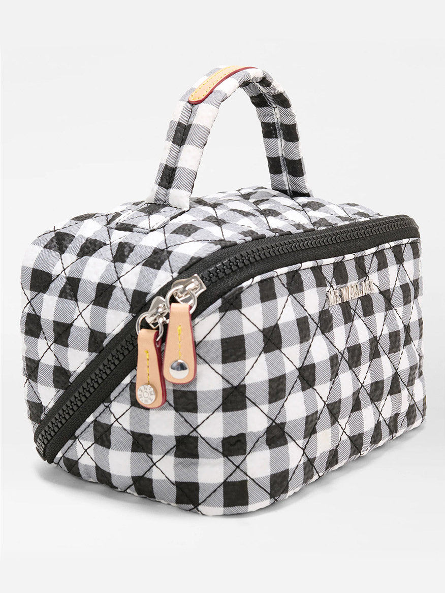 The MZ Wallace Metro Accordion Cosmetic II in Black/White Gingham Oxford features a quilted design, handle, and dual zipper pulls—ideal for travel accessories—shown on a plain white background.