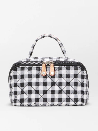 The MZ Wallace Metro Accordion Cosmetic II in Black/White Gingham Oxford is a compact quilted organizer bag with a checkered pattern, top handle, and double zipper—ideal for travel accessories.