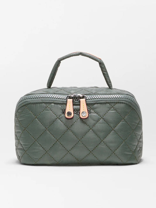 The MZ Wallace Metro Accordion Cosmetic II in Juniper Oxford is a quilted green rectangular bag made from recycled Oxford nylon, featuring two beige zipper pulls and a short top handle. Shown against a plain white background, it’s the perfect cosmetic organizer for everyday essentials.