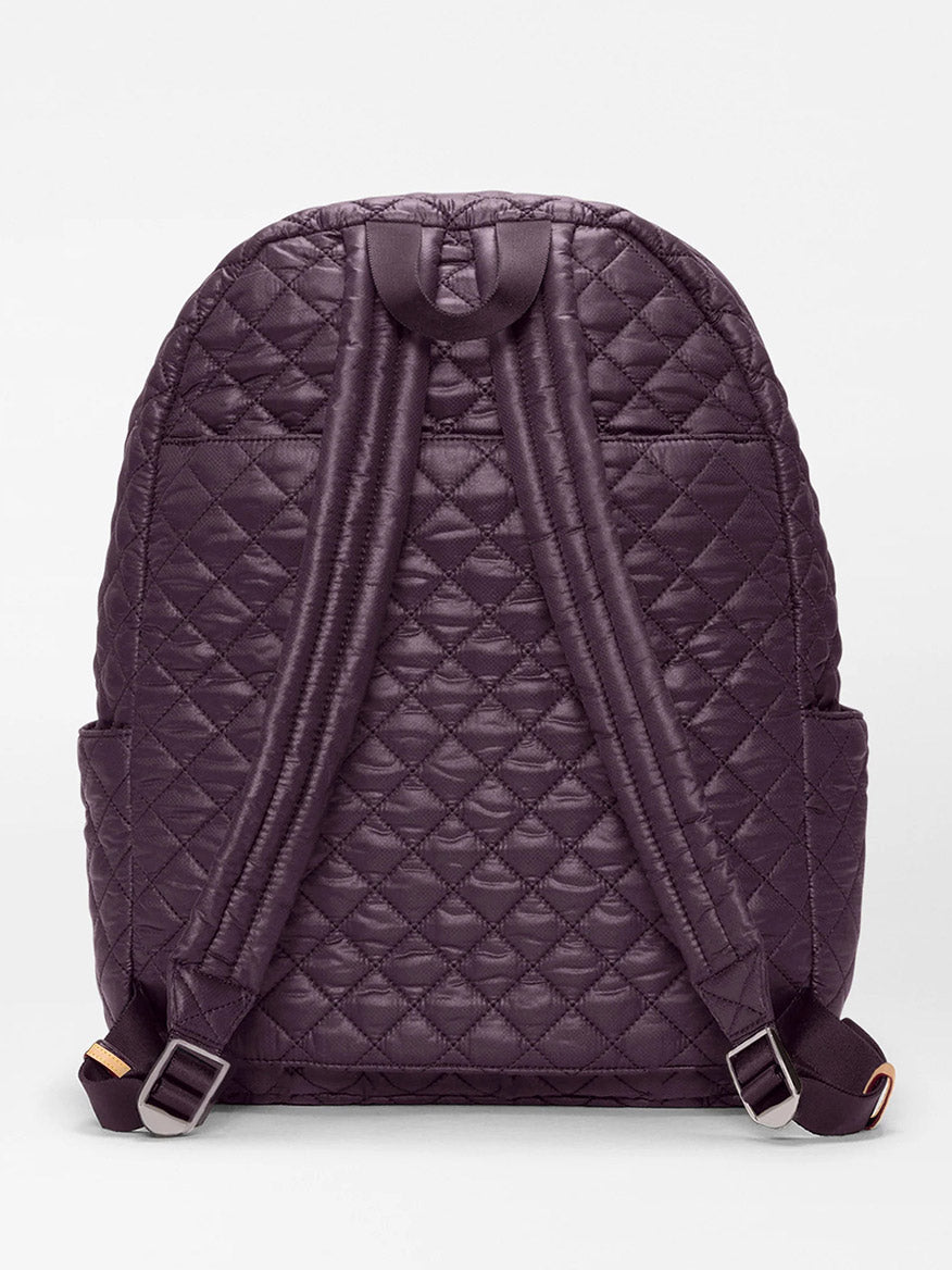 The MZ Wallace Metro Backpack II in Raisin Oxford is shown from the back, crafted from recycled Oxford nylon with padded shoulder straps and handy side pockets.