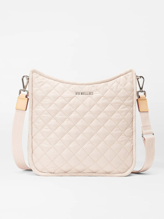 Beige quilted MZ Wallace Metro Box Crossbody in Mushroom Oxford with adjustable strap, signature red leather edging, and brand logo embossed.