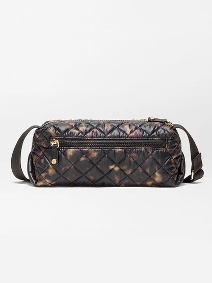 MZ Wallace Metro East West Crossbody in Tortoise Shell Oxford: a quilted recycled nylon bag with a dark tortoise shell pattern, zippered exterior pocket, and adjustable strap.