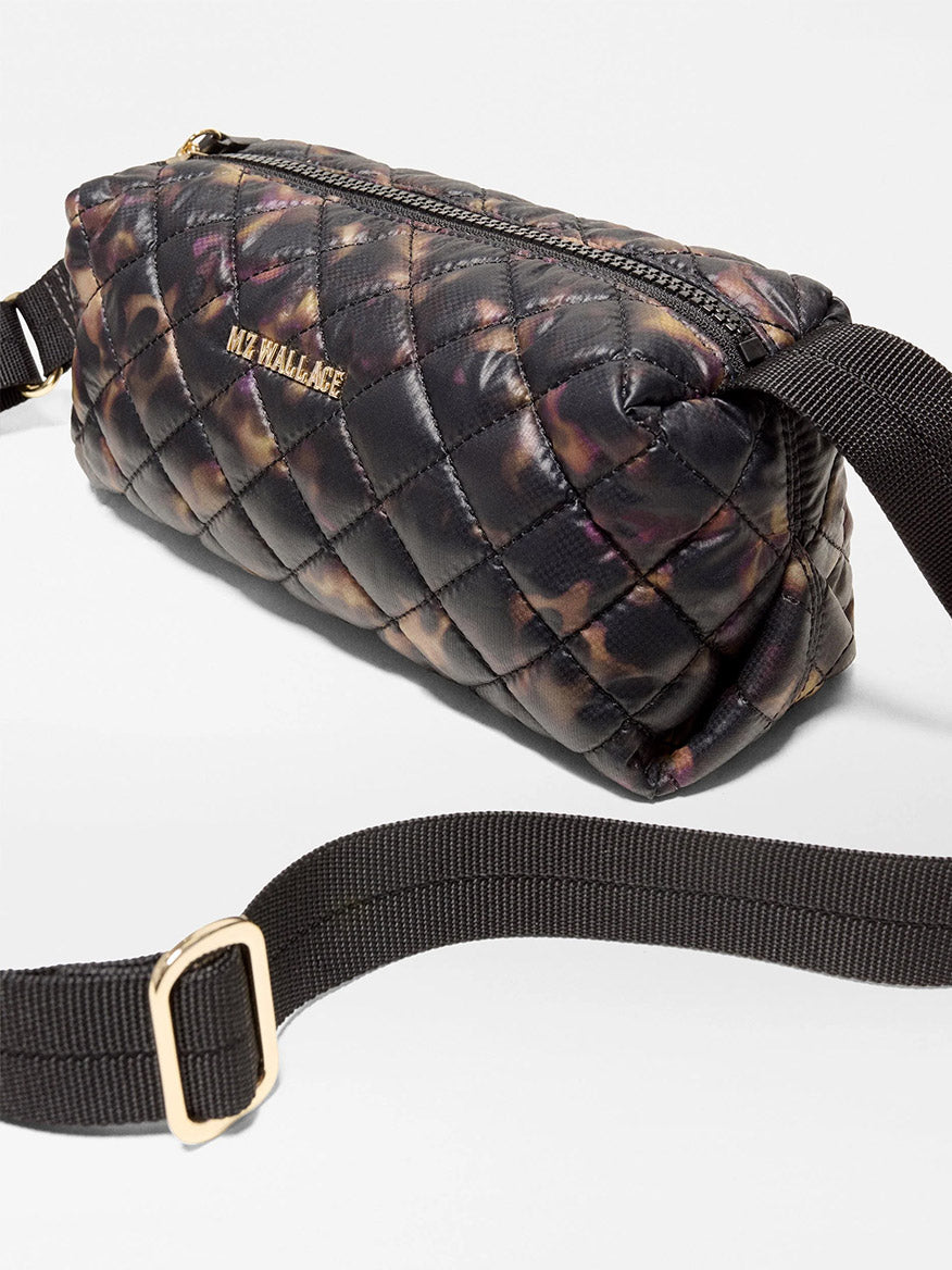 MZ Wallace Metro East West Crossbody in Tortoise Shell Oxford: a quilted recycled nylon crossbody bag in a dark tortoise shell print with a black adjustable strap.