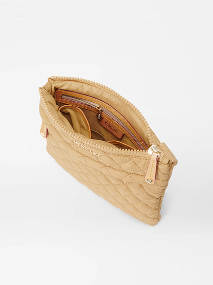 Camel Oxford quilted crossbody bag open to show inner compartments on a white background.