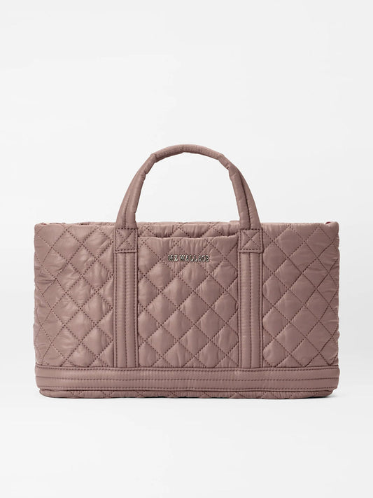 A quilted, MZ Wallace Metro Utility Crossbody in Mauve Oxford with padded nylon handles, featuring a stitched logo on the front.