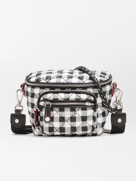 The MZ Wallace Micro Crosby Crossbody Sling in Black/White Gingham Oxford is a small recycled nylon bag featuring a checkered pattern, front zipper pockets, silver hardware, and a chain strap for hands-free convenience.