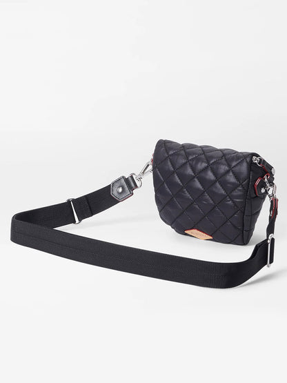 Here is a description of the MZ Wallace Micro Crosby Crossbody Sling in Black Oxford using the provided product data:

"The MZ Wallace Micro Crosby Crossbody Sling in Black Oxford is a black quilted shoulder purse featuring a wide adjustable strap, silver hardware, Italian leather trim, and a zip top closure, all set against a plain white background.