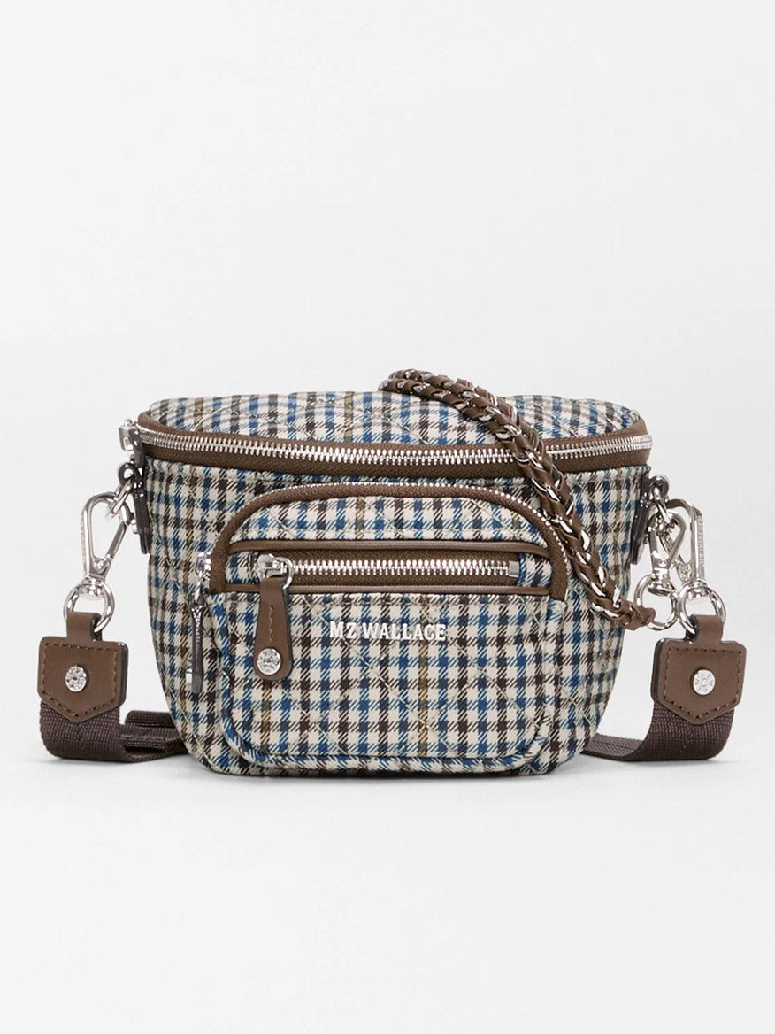 MZ Wallace Micro Sutton Sling in Heritage Check features a brown, blue, and white plaid pattern, two front zippered pockets, silver hardware, Italian leather accents, and a detachable strap.