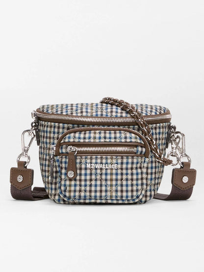 MZ Wallace Micro Sutton Sling in Heritage Check features a brown, blue, and white plaid pattern, two front zippered pockets, silver hardware, Italian leather accents, and a detachable strap.