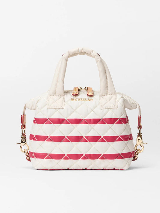 The MZ Wallace Micro Sutton in Sandshell/Apple Charter Stripe Oxford is a small quilted handbag with white and pink diagonal stripes, gold hardware, short handles, and a detachable crossbody strap for versatile wear.