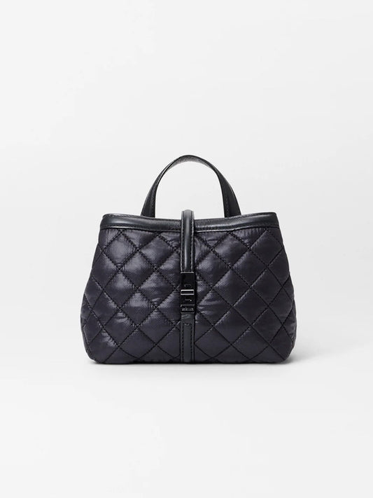 The MZ Wallace Mini Astor Top Handle in Black Oxford, a quilted handbag with a top handle and Italian leather strap closure, is elegantly set against a plain white background.