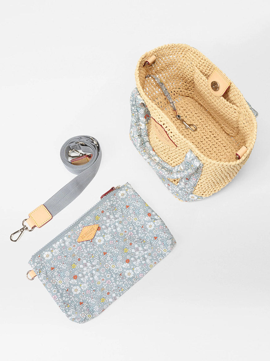 The MZ Wallace Mini Crochet Tote in Crochet/June's Meadow Liberty Fabric features a woven beige design, blue floral pouch, light blue detachable strap, and Italian leather trim accents, shown on a white background.