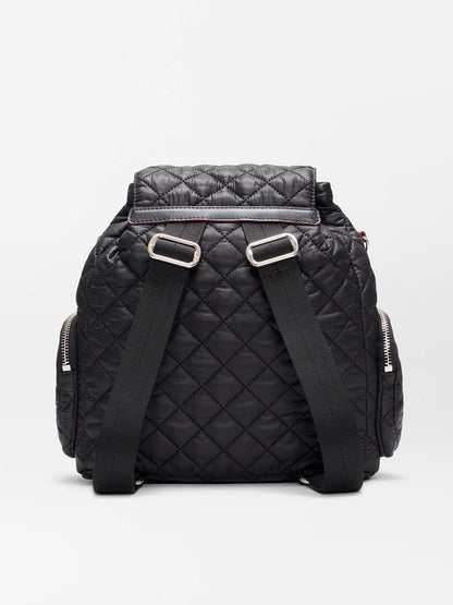 The MZ Wallace Mini Crosby Backpack in Black Oxford is shown from the back, featuring two adjustable shoulder straps and zippered side pockets. Made from recycled nylon, this stylish backpack is also eco-friendly.