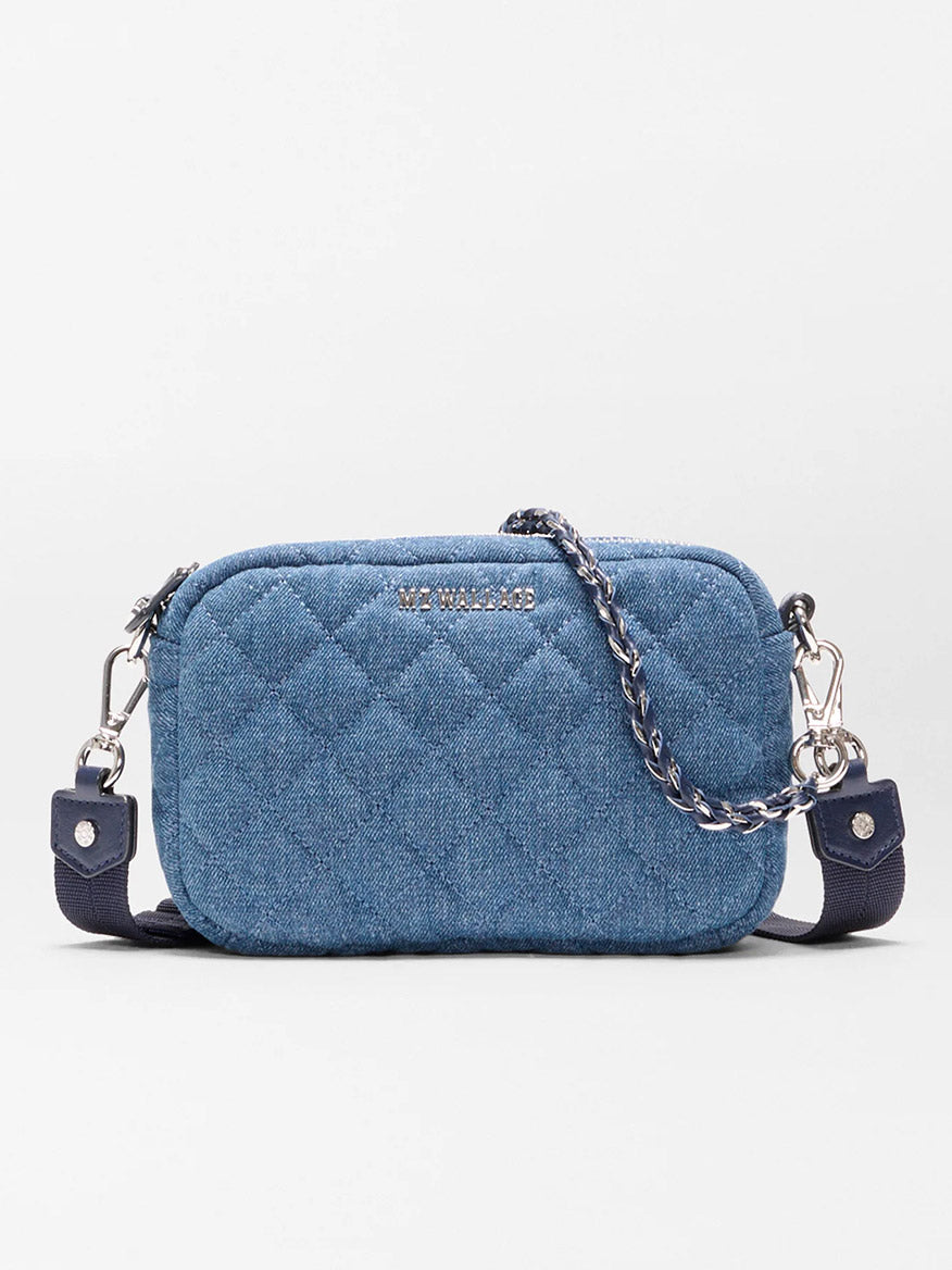 The MZ Wallace Mini Crosby Crossbody II in True Blue Denim is a small blue quilted bag with a detachable chain strap and silver hardware, shown against a plain background.