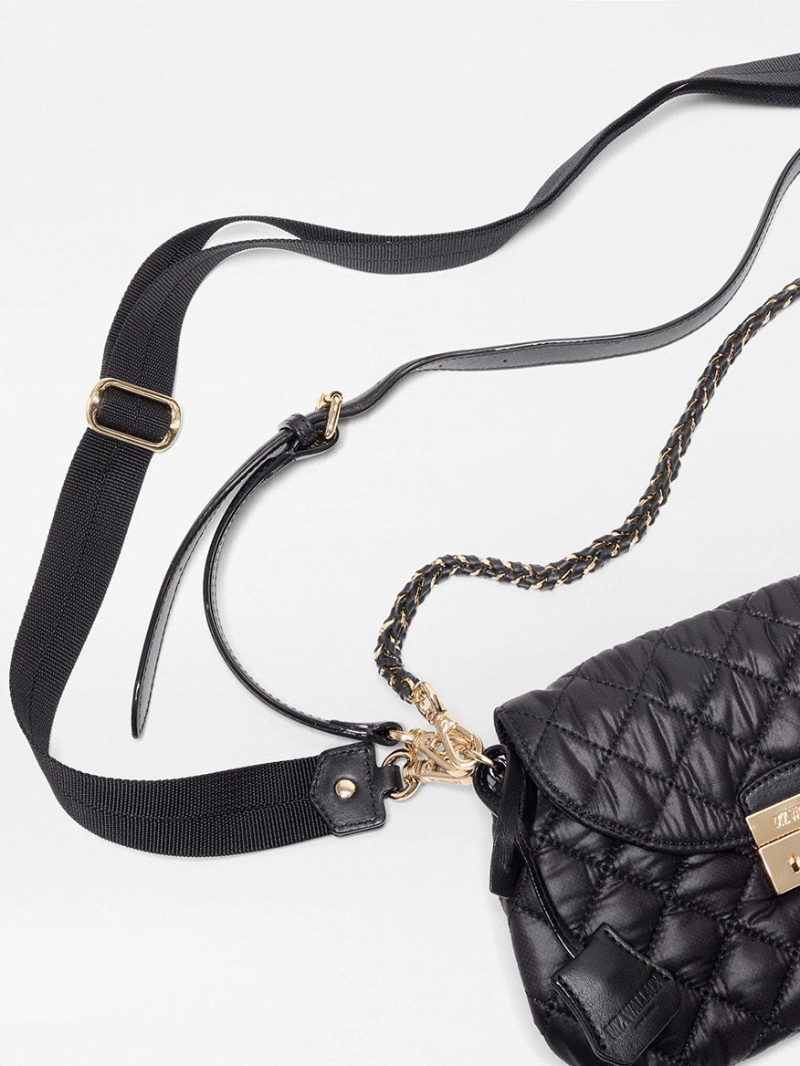 MZ Wallace Mini Crosby Lock Shoulder in Black Oxford, a quilted recycled nylon bag featuring a metal chain strap and a detachable webbing crossbody strap.
