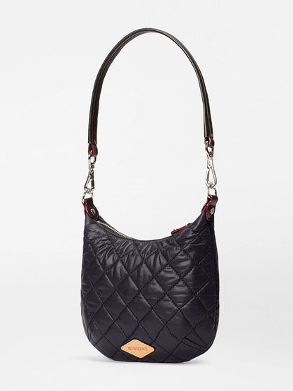 The MZ Wallace Mini Crosby Sienna in Black Oxford features Italian leather handles, silver hardware, and a tan logo patch, shown against a plain white background.