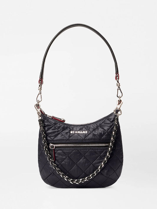 The MZ Wallace Mini Crosby Sienna in Black Oxford features a quilted design, zippered front pocket, chain and leather strap, Italian leather handles, and the "MZ WALLACE" logo—your ideal everyday shoulder satchel.