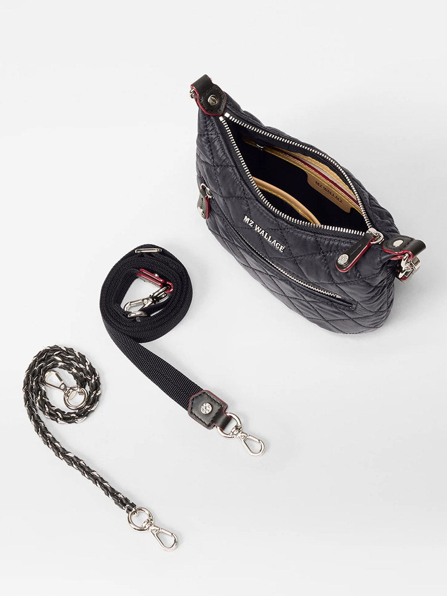 The MZ Wallace Mini Crosby Sienna in Black Oxford features silver hardware and comes with two detachable straps—one black and one braided adjustable—shown against a white background.