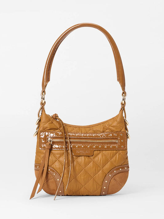 The MZ Wallace Mini Multi Stud Crosby Sienna in Amber Stud & Suede is a tan quilted leather handbag with a single handle, gold hardware, zipper closure, decorative studs, and tassel accents on a plain white background.